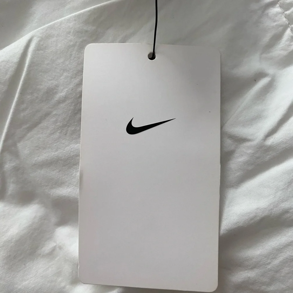 Nike Gray Long Sleeve Baby Onesie